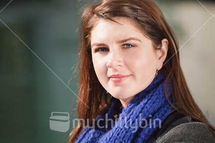 Young brunette woman, with blue scarf.