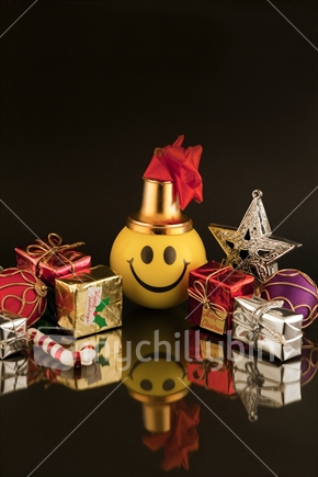 Merry Christmas - yellow smiley face with miniature Xmas decorations