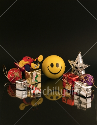 Happy Christmas - smiley face ball with miniature Xmas decorations