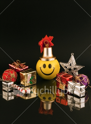 Happy Christmas - yellow smiley face surrounded by miniature gifts