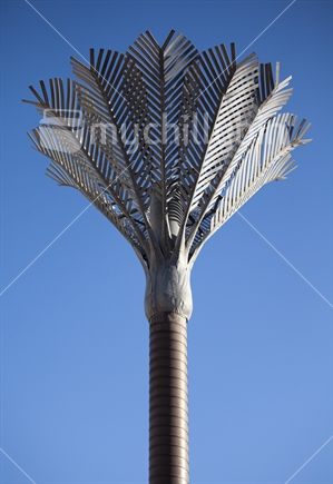 Metallic Nikau Palm sculptures decorate the Civic Center near Wellington's waterfront. Designed by Ian Athfield 