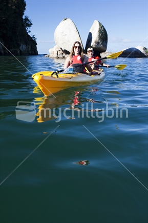 Mates in kayak at Split Apple Rock, on the edge of Abel Tasman National Park