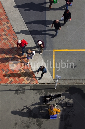 Busker and shoppers at Nelson's iconic Saturday markets - aerial view