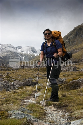 Polynesian woman tramping on expedition through Nelson Lakes National Park.