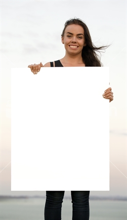 18-year-old girl holds blank white advertising card; portrait orientation