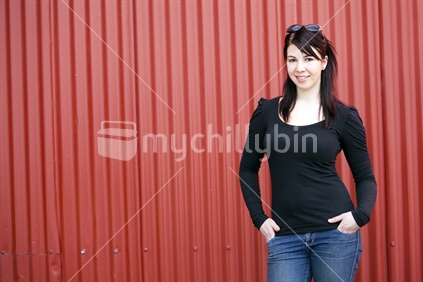 Gorgeous young woman in jeans smiling