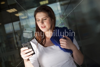 Attractive young woman using a smart phone 