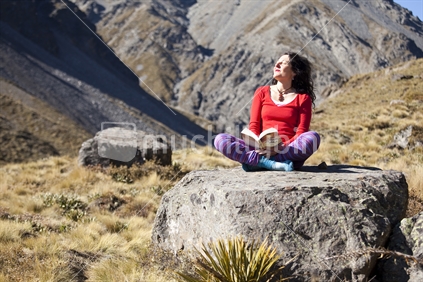 Red lady enjoys sunbathing on a boulder up the Hodder Valley