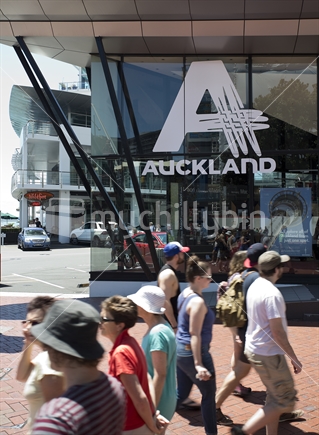 Auckland i-Site visitor centre on Quay Street with tourists passing by