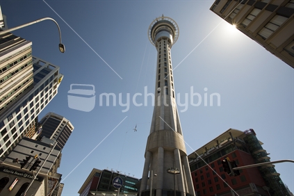 Human spider dangles from Auckland's famous Sky Tower (raised ISO)