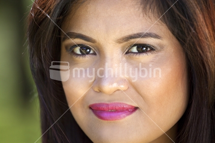 Portrait of a pretty young Asian woman smiling