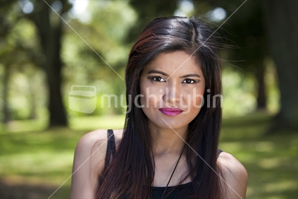 Attractive young Philippino woman in black singlet