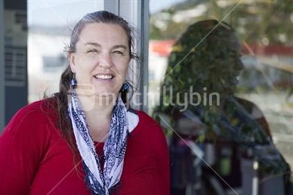Woman in her 40s wearing red top