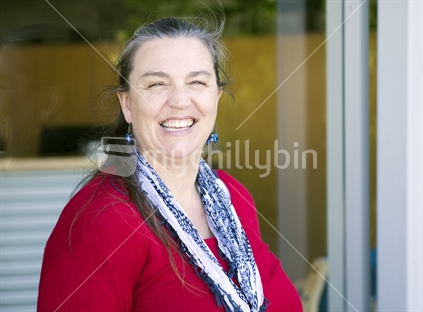 Woman in her 40s wearing red top