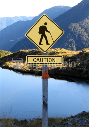Quirky road sign on Little Wanganui Saddle protests proposed road through Kahurangi National Park.