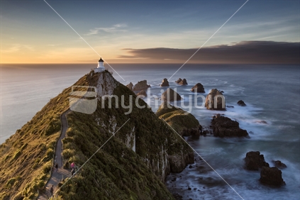 Nugget Point stands defiantly above the pounding Pacific