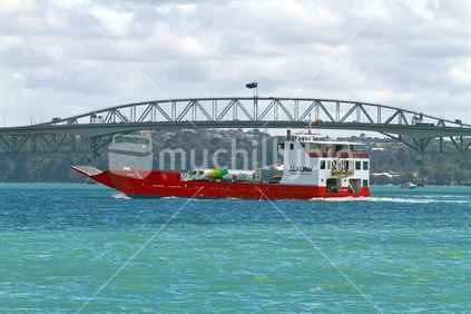 Red Ferry passing in front of harbour bridge