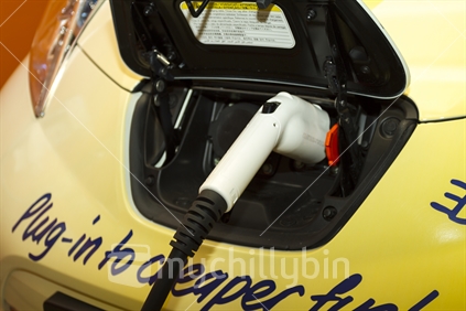 Charging unit for electric car plugged in 