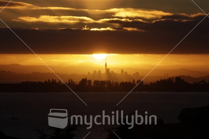 Auckland City during sunset as seen from Waiheke Island.