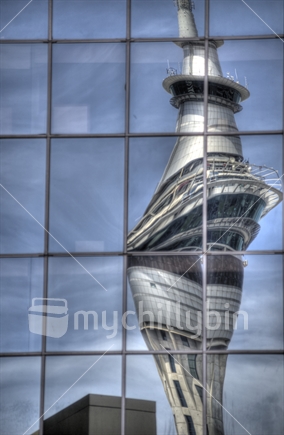 Auckland's skytower; a distorted reflection in the windows of a neighbouring building