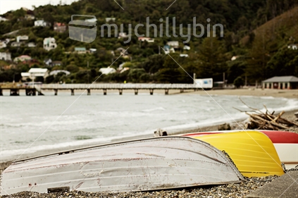 Tinny or plastic?  Boats sitting idle beside the beach in Days Bay,  Eastbourne.  Days Bay wharf in the background.