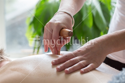 Massage therapist providing treatment.
