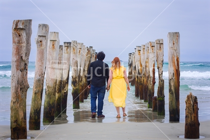 A couple walking at the beach, St Clair, Dunedin.