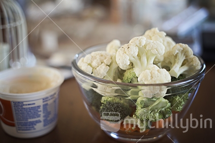 Fresh cut cauliflower and broccoli in a bowl (raised ISO)