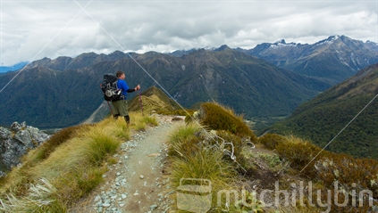 A tramper enjoys the vista on the Kepler track, Te Anau