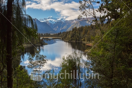 Mt Cook reflected in the calm waters of Lake Matheson