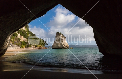 The arch frames the view into Cathedral Cove on the Coromandel peninsula