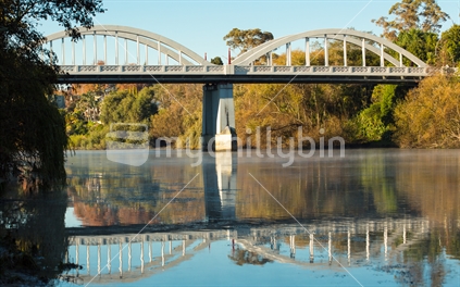 The iconic Fairfield bridge reflected in the Waikato river