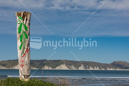 Local art work has the beautiful Mahia peninsula as a backdrop