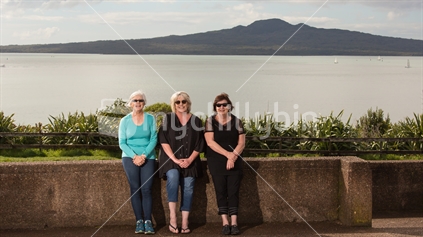 Friends enjoy a visit to the Michael Joseph Savage memorial with Rangitoto Island as the backdrop