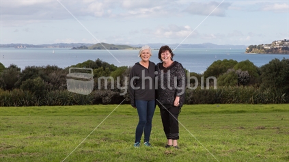Lovely ladies at the Michael Joseph Savage Memorial Park with the backdrop of the Waitemata Harbour on a sunny winter day in Auckland