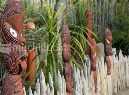 Maori carvings form part of a fenceline, Hamilton Gardens