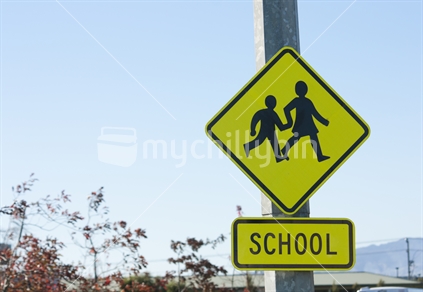 School sign with children crossing.  