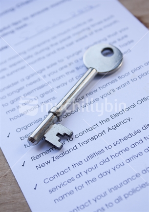 Key on top of a moving home checklist.  