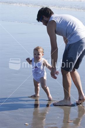Dad with daughter on beach