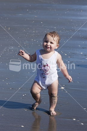 Toddler playing at the beach