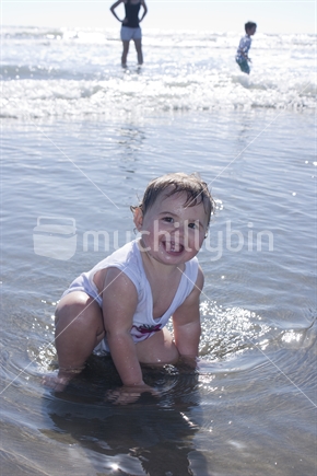 Toddler playing in the sand at beach