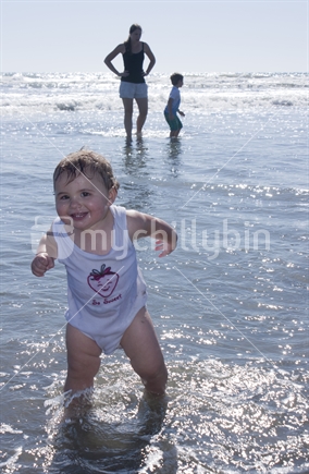 Toddler playing at the beach