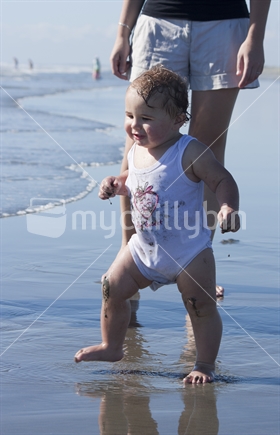 Toddler playing at the beach 