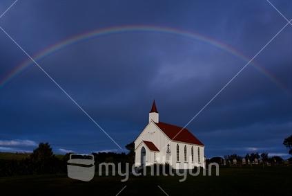 A church and the rainbow at Awhitu.