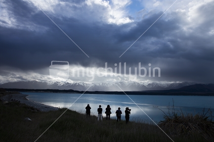 Tourist Photographing Lake Pukaki