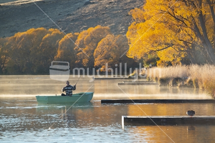 Fisherman in a boat on the lake (2 of 2)
