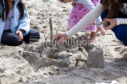 Family making a sand castle