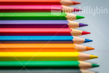 Vibrant Colour pencils all lined up evenly