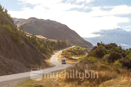 Campervan drives on the asphalt road in New Zealand