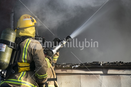 Firemen fighting house fire 